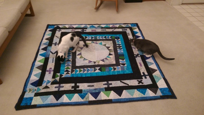 Quilt passes inspection by Xander and Anya